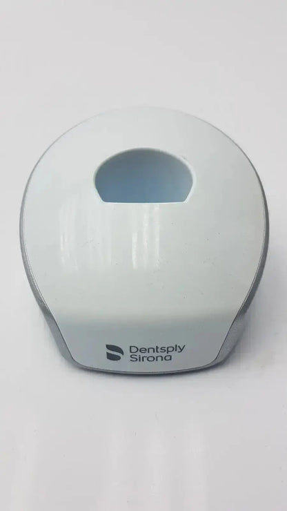 White and gray dentsply sirona smartlite focus curing light charger with smooth rounded design for dental use