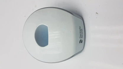 White plastic dentsply sirona smartlite focus curing light charger base with sleek rounded design and logo printed on side