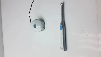 Gray and blue handheld dentsply sirona smartlite focus dental curing light with ergonomic design for dental curing use