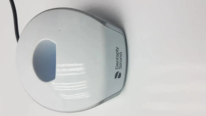 White and silver dentsply sirona smartlite focus dental curing light with sleek rounded design for dental curing
