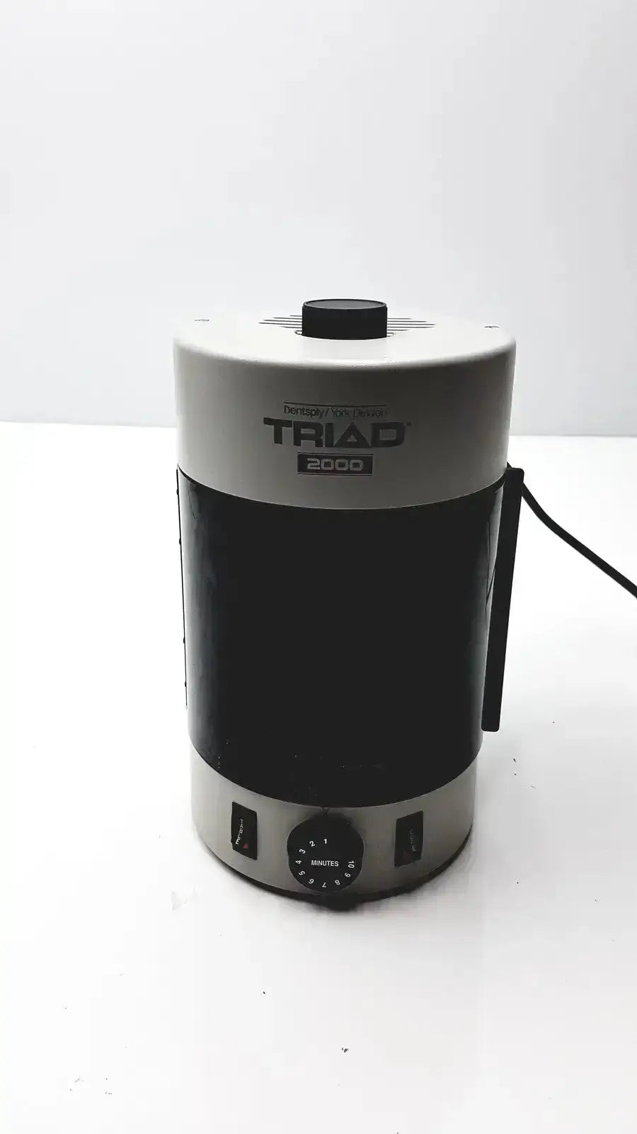 Black and silver dentsply triad 2000 electric kettle with black handle and control dial for trubyte curing system use