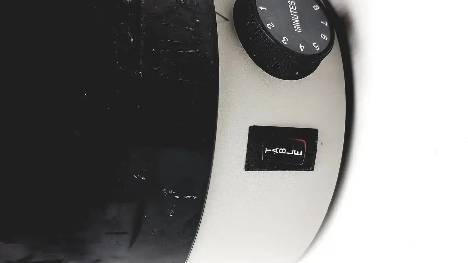 White microwave timer with black dial and button for dentsply triad 2000 visible light cure and trubyte curing system