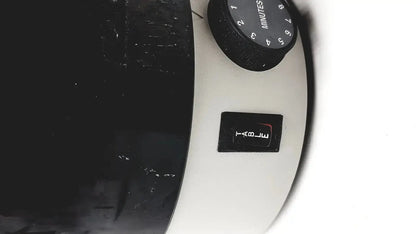White microwave timer with black dial and button for dentsply triad 2000 visible light cure and trubyte curing system