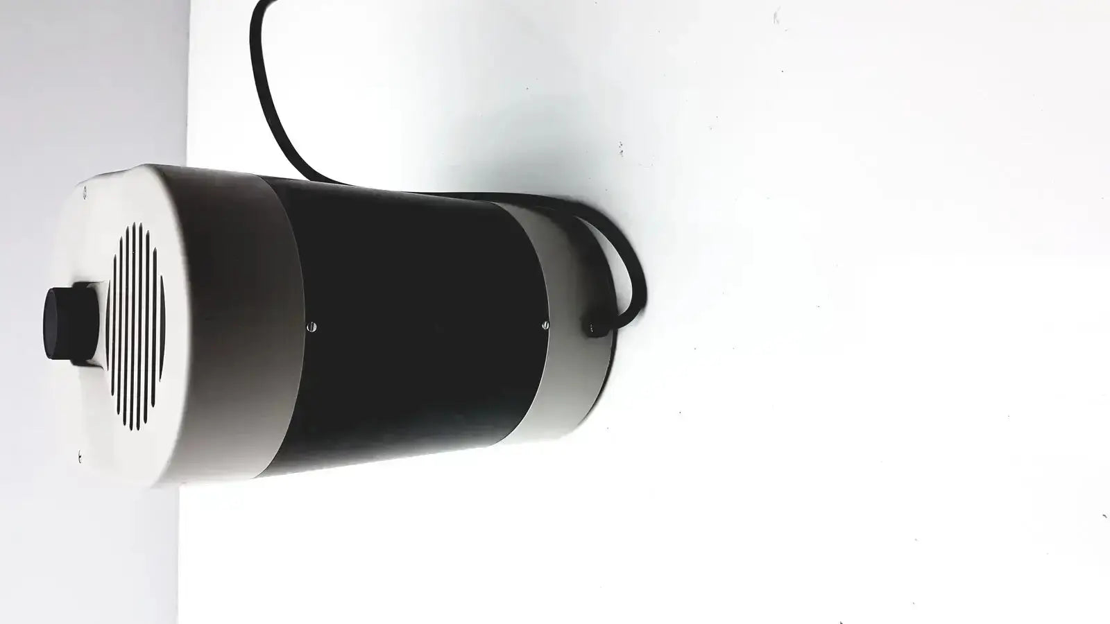 Black and silver cylindrical industrial fan with vented front panel and power cord for dentsply triad 2000 visible light cure system