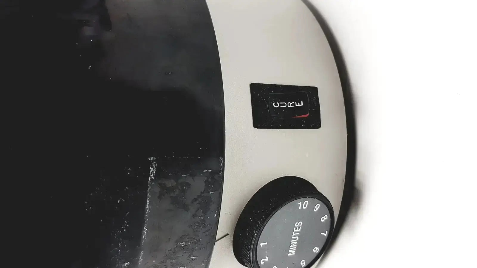 White and black dual-tone dentsply triad 2000 visible light cure electric steam generator with circular timer dial