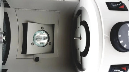 White dentsply triad 2000 visible light cure system with circular lamp and black control knobs for trubyte curing