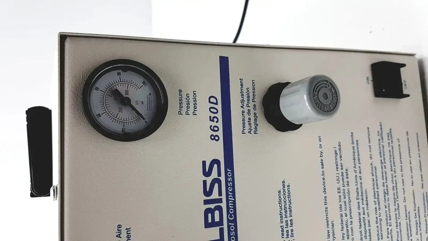 Gray metal heavy duty aerosol compressor bliss 8650d with black-rimmed pressure gauge and white knob used medical equipment for sale
