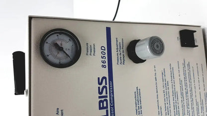 Gray metal heavy duty aerosol compressor bliss 8650d with black-rimmed pressure gauge and white knob used medical equipment for sale