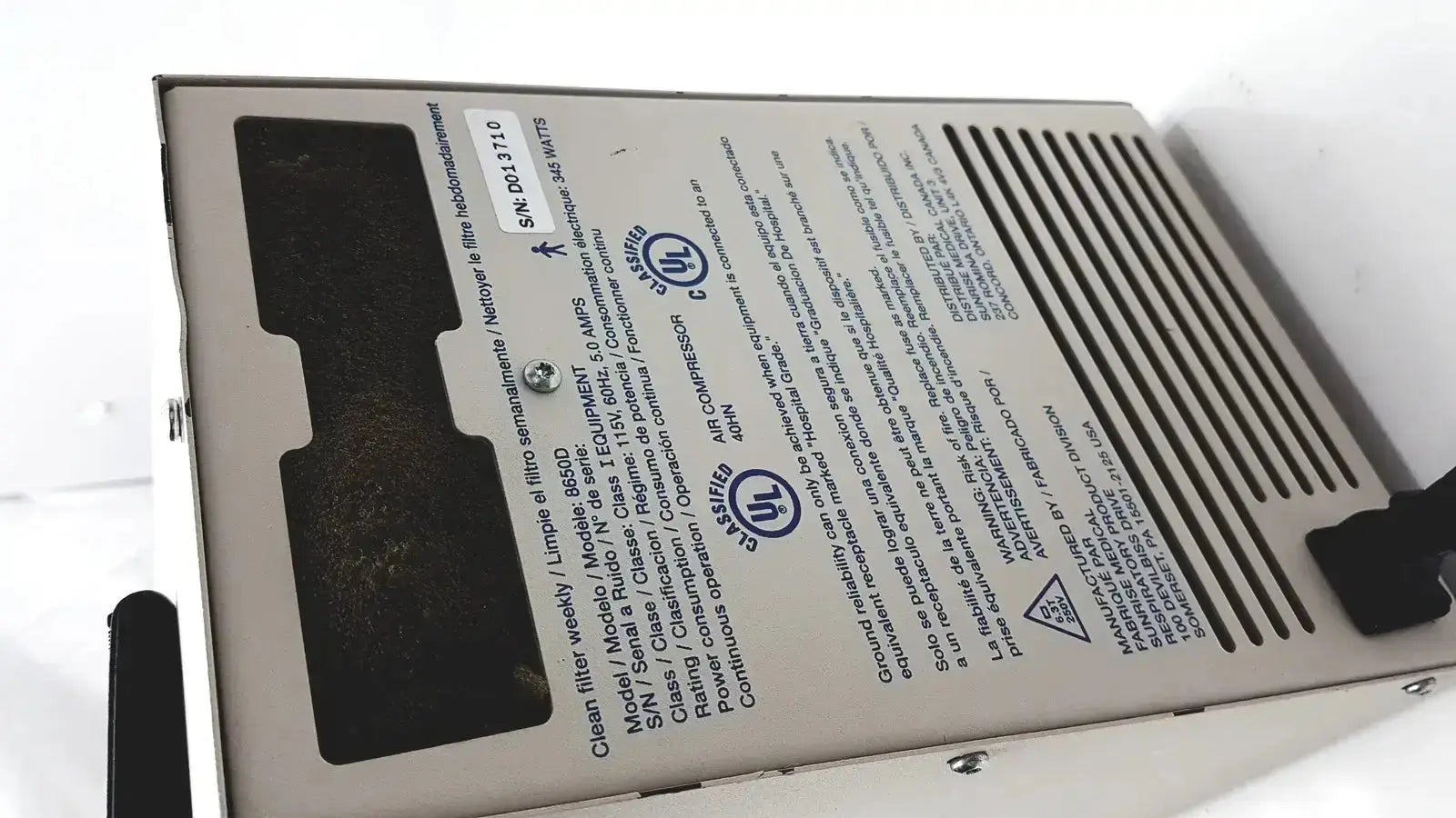 Silver-colored metal devilbiiss heavy duty aerrosol compressor 8650d with black ventilation slats and model label