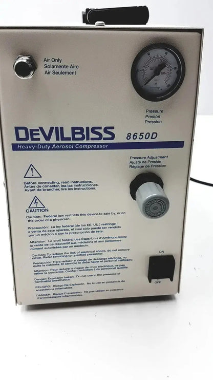 Devilbiss heavy duty aerosol compressor 8650d with beige metal casing black pressure gauge and control knobs used medical equipment for sale