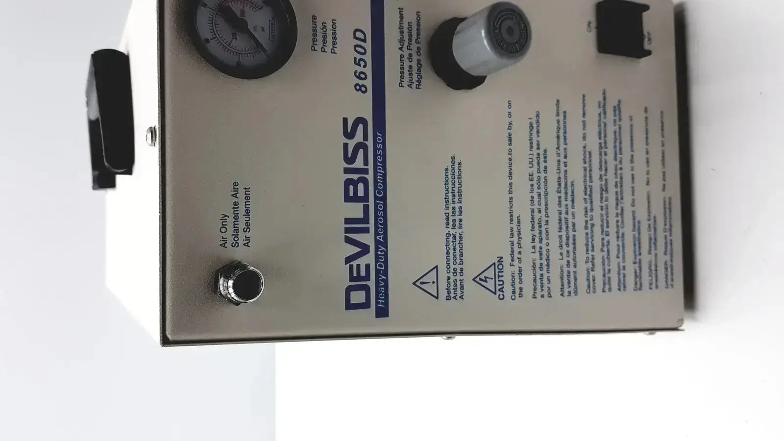 Silver metal heavy duty Devilbiss aerosol compressor model 8650d with black pressure gauge and control knobs for medical use