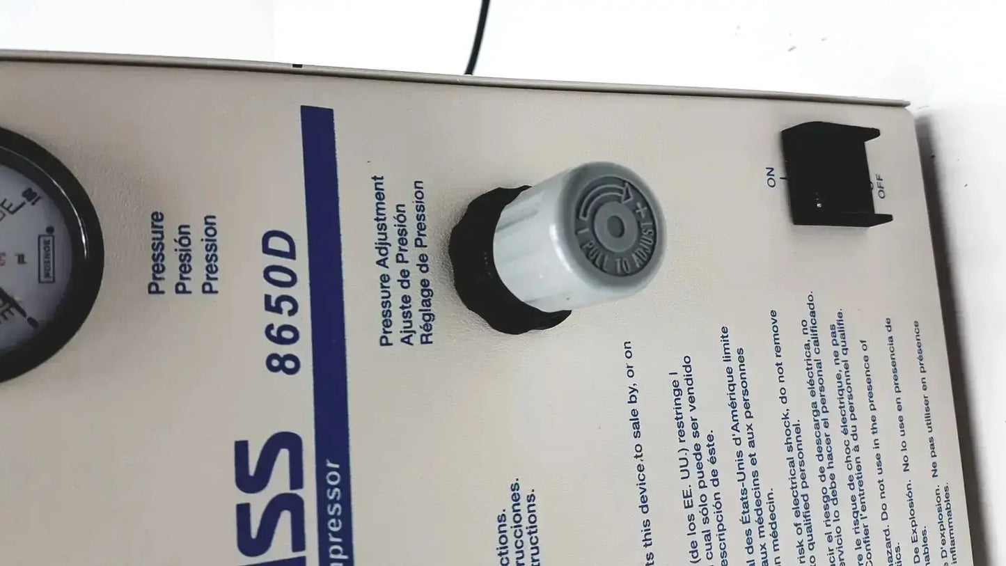 White plastic pressure adjustment knob with black rubber grip and gray dial for Devilbiiss heavy duty aerosol compressor 8650d used medical equipment for sale