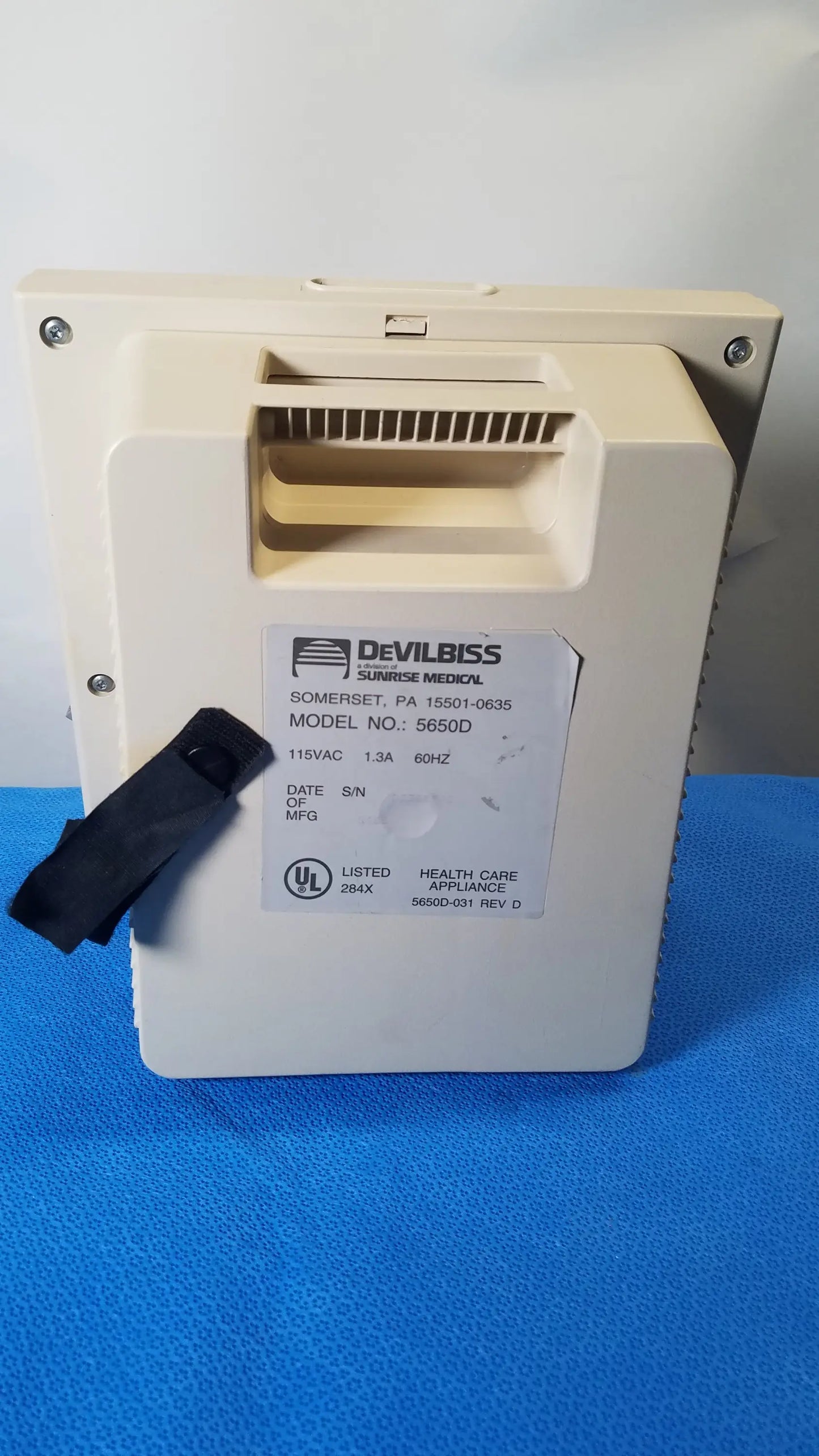 Beige plastic medical equipment DeVilbiss 5650D Pulmo-Aide compressor nebulizer system with black strap for reuse medical use