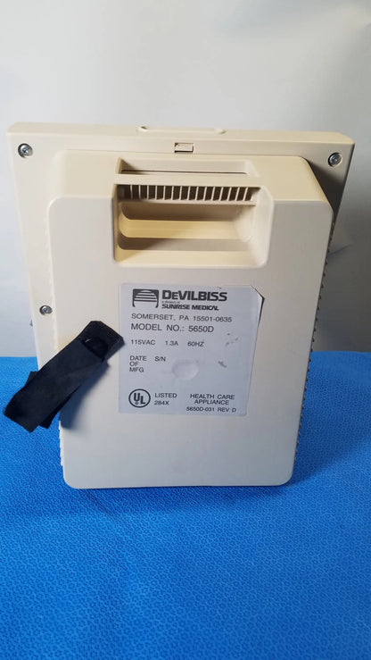 Beige plastic medical equipment DeVilbiss 5650D Pulmo-Aide compressor nebulizer system with black strap for reuse medical use
