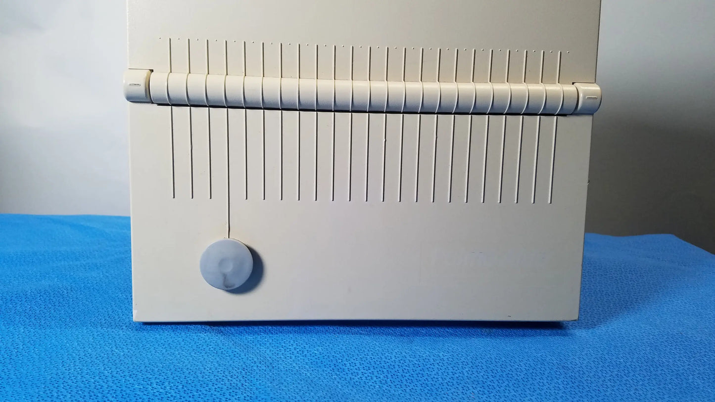 Beige plastic card reader with vertical slits and circular button for reuse medical equipment DeVilbiss 5650D Pulmo-Aide compressor nebulizer system