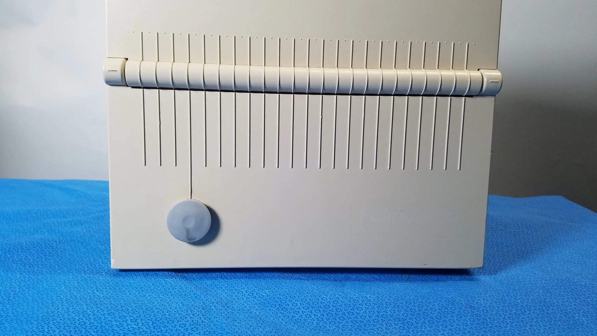 Beige plastic card reader with vertical slits and circular button for reuse medical equipment DeVilbiss 5650D Pulmo-Aide compressor nebulizer system