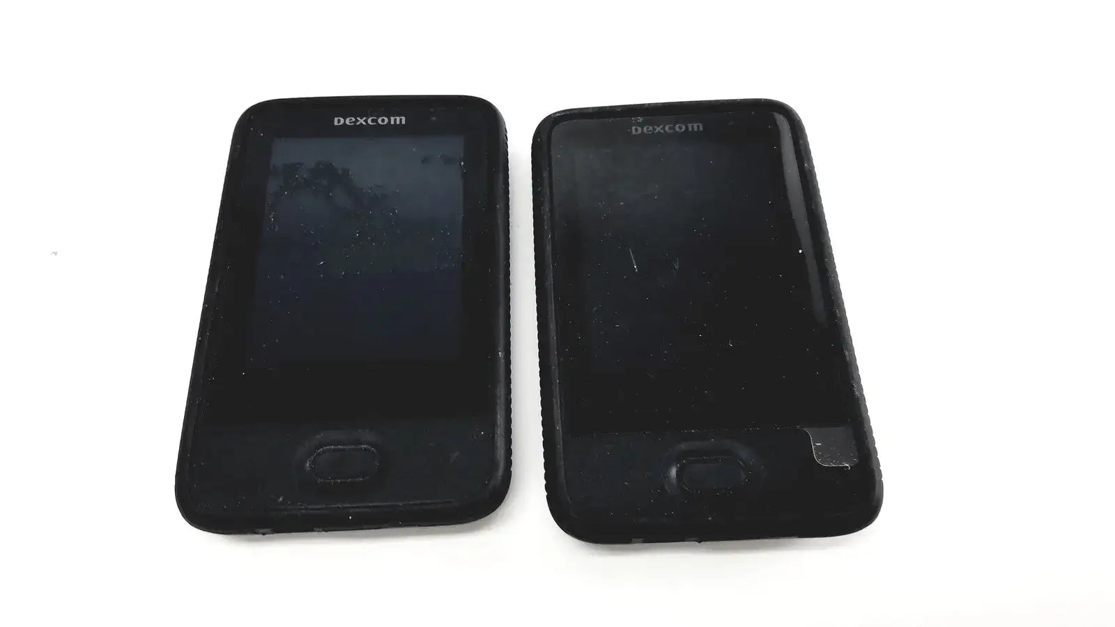 Black dexcom g6 receiver with rectangular screen and physical button for reuse medical glucose monitoring