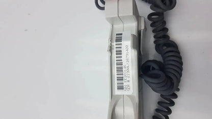 Gray plastic doppllex d900 handheld portable doppler with coiled black cable and barcode label visible on the back side