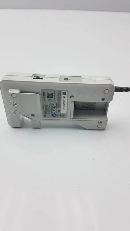 White plastic doppllex d900 handheld portable doppler with black cable extending from its side for medical use