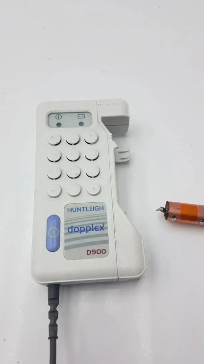 White plastic huntleigh doppllex d900 handheld portable doppller with keypad and attached cable for medical use
