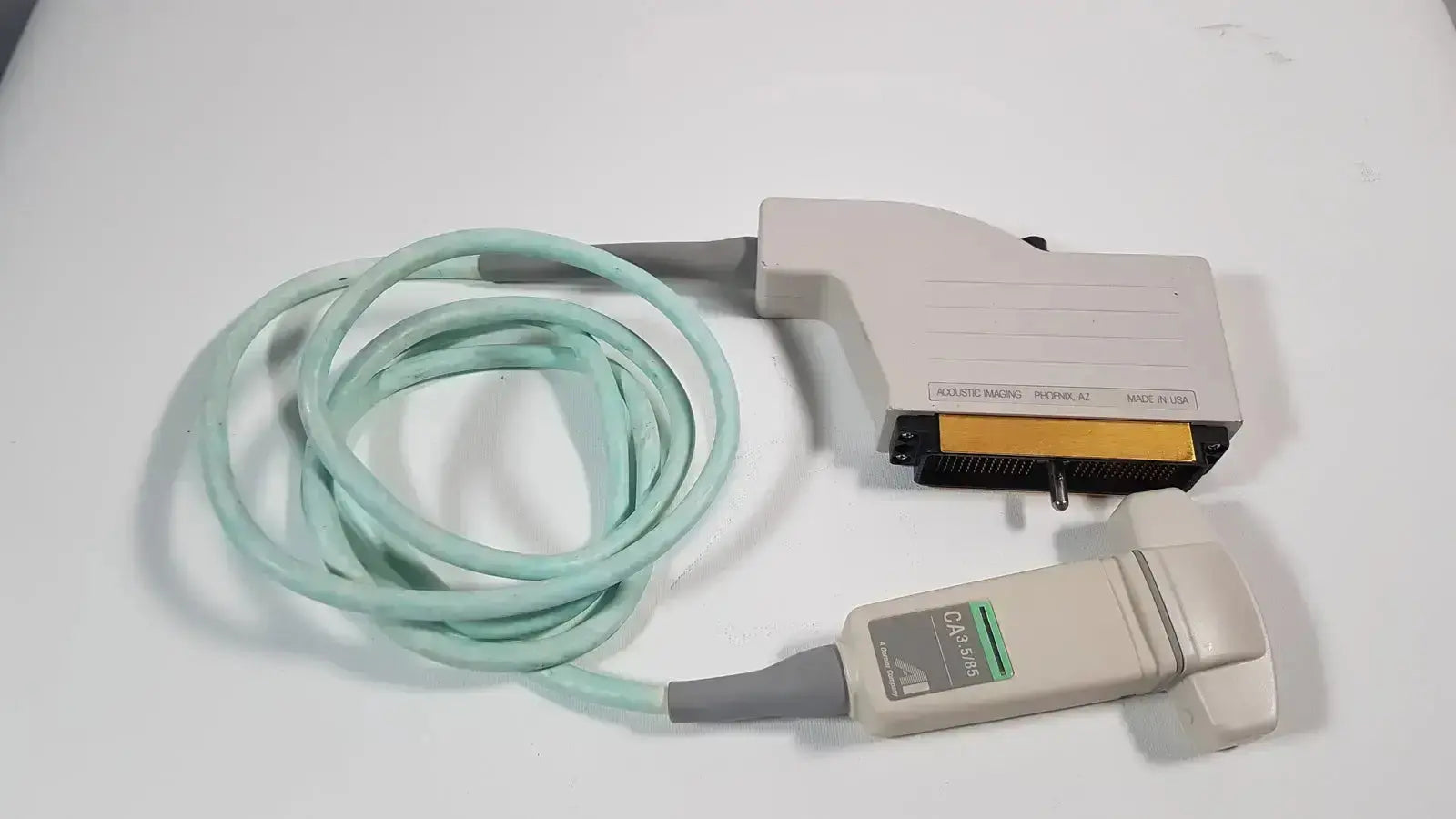 Beige and gray dornier acoustic imaging ai ca 3.5/85 curved array ultrasound transducer with coiled light green cable