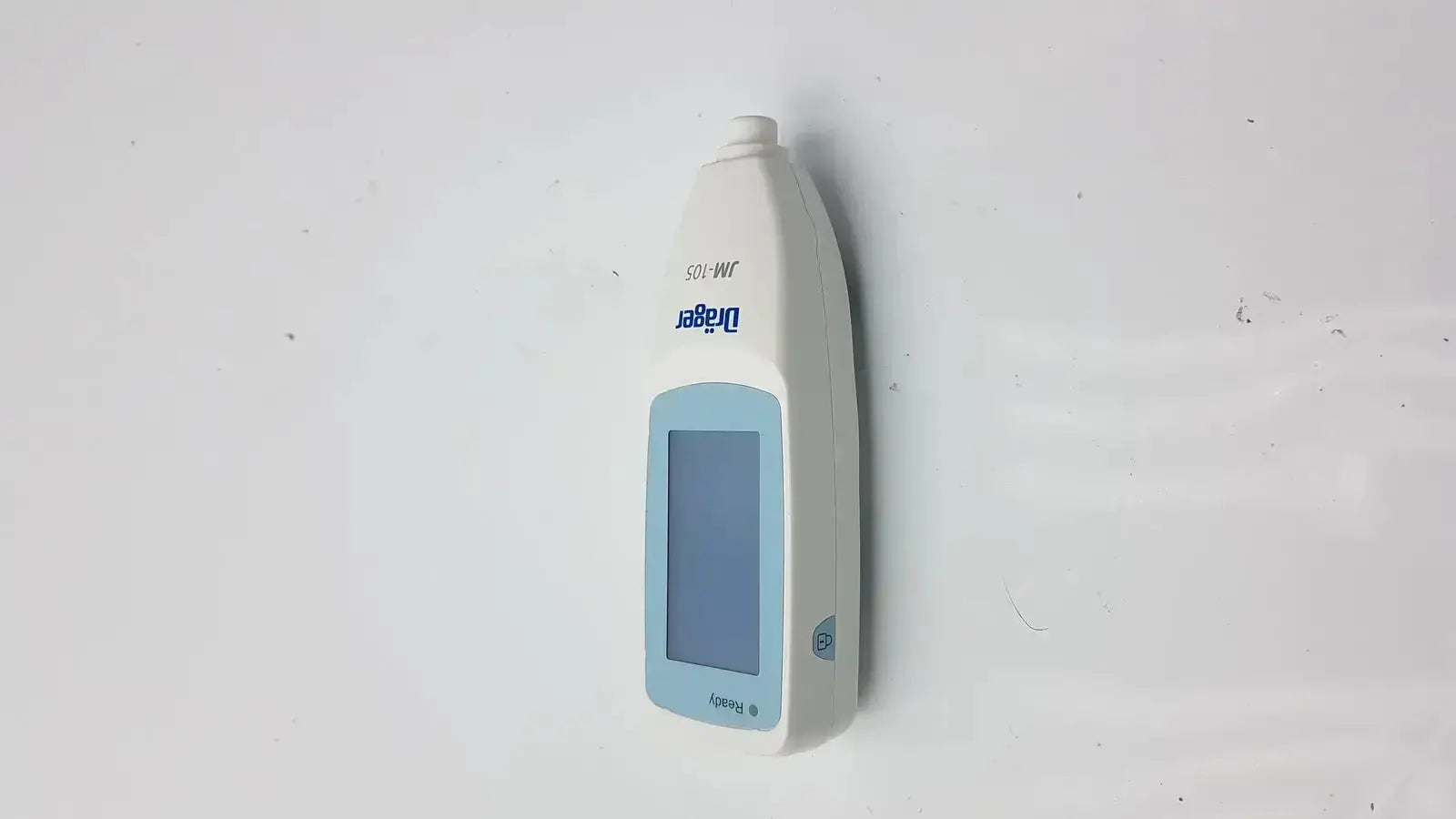 White and light blue drager jaundice meter jm-105 handheld device with digital display screen for accurate readings
