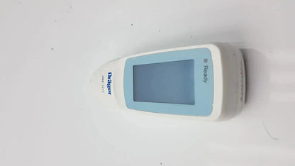 White and light blue drager jaundice meter jm-105 handheld device with rectangular screen displaying ready message