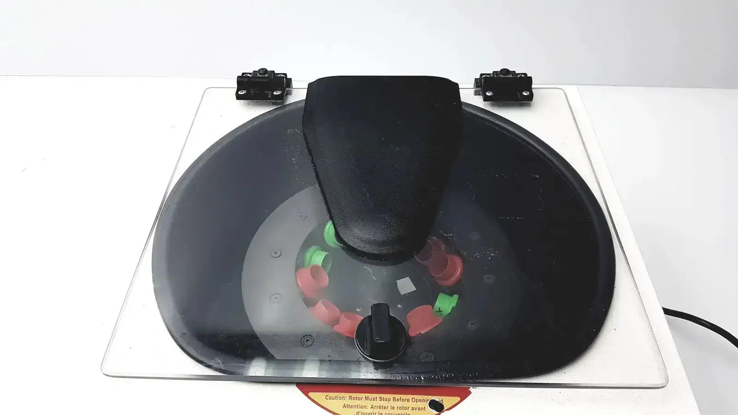Black plastic rotary caster with red and green components on transparent base for drucker horizon laboratory centrifuge 755v