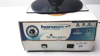 White horizon laboratory centrifuge with blue and teal control panel by the drucker co ideal for buy used medical equipment