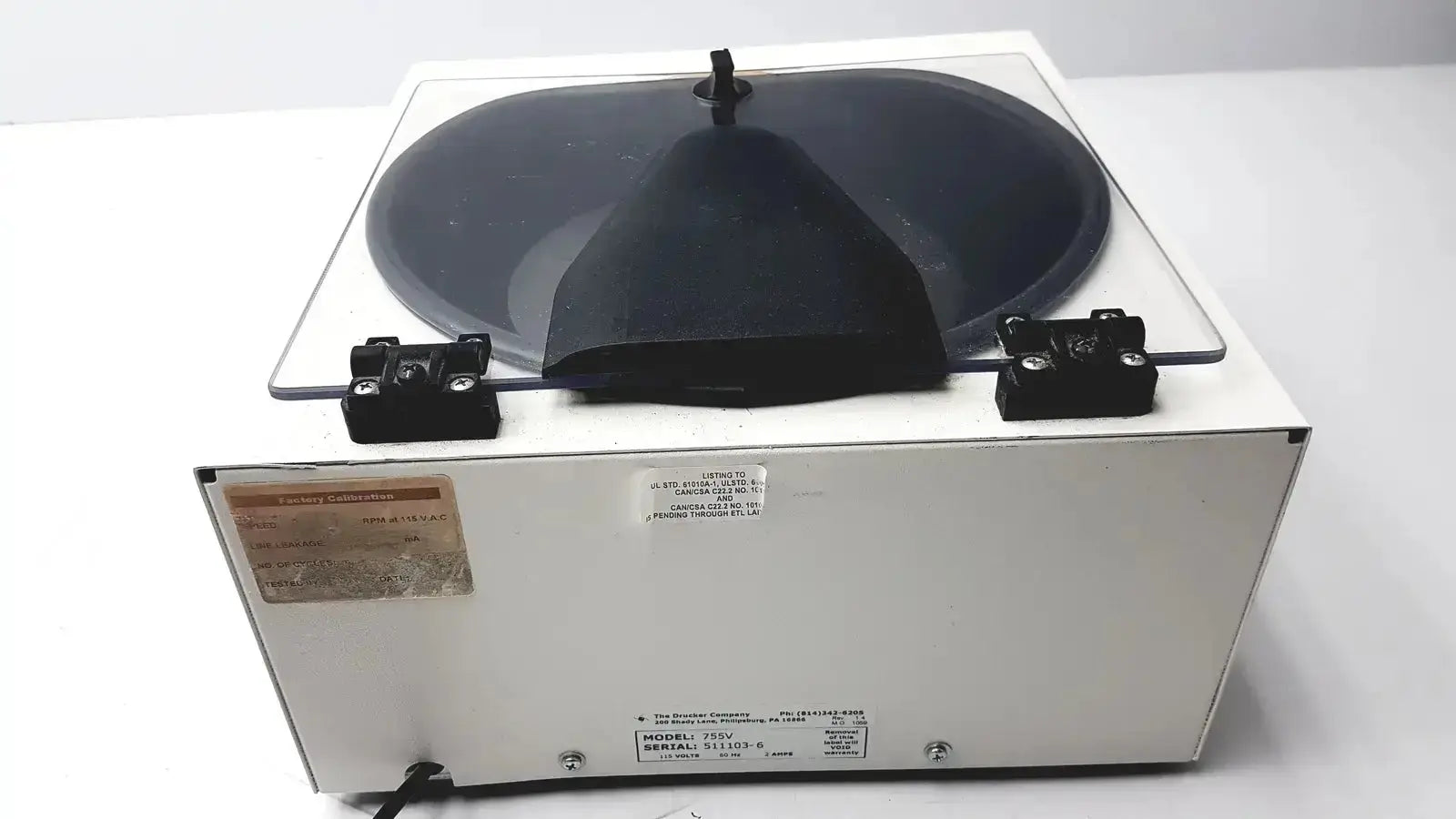 Drucker Horizon laboratory centrifuge 755v with white rectangular body and black conical rotor cover in pre owned medical equipment sale