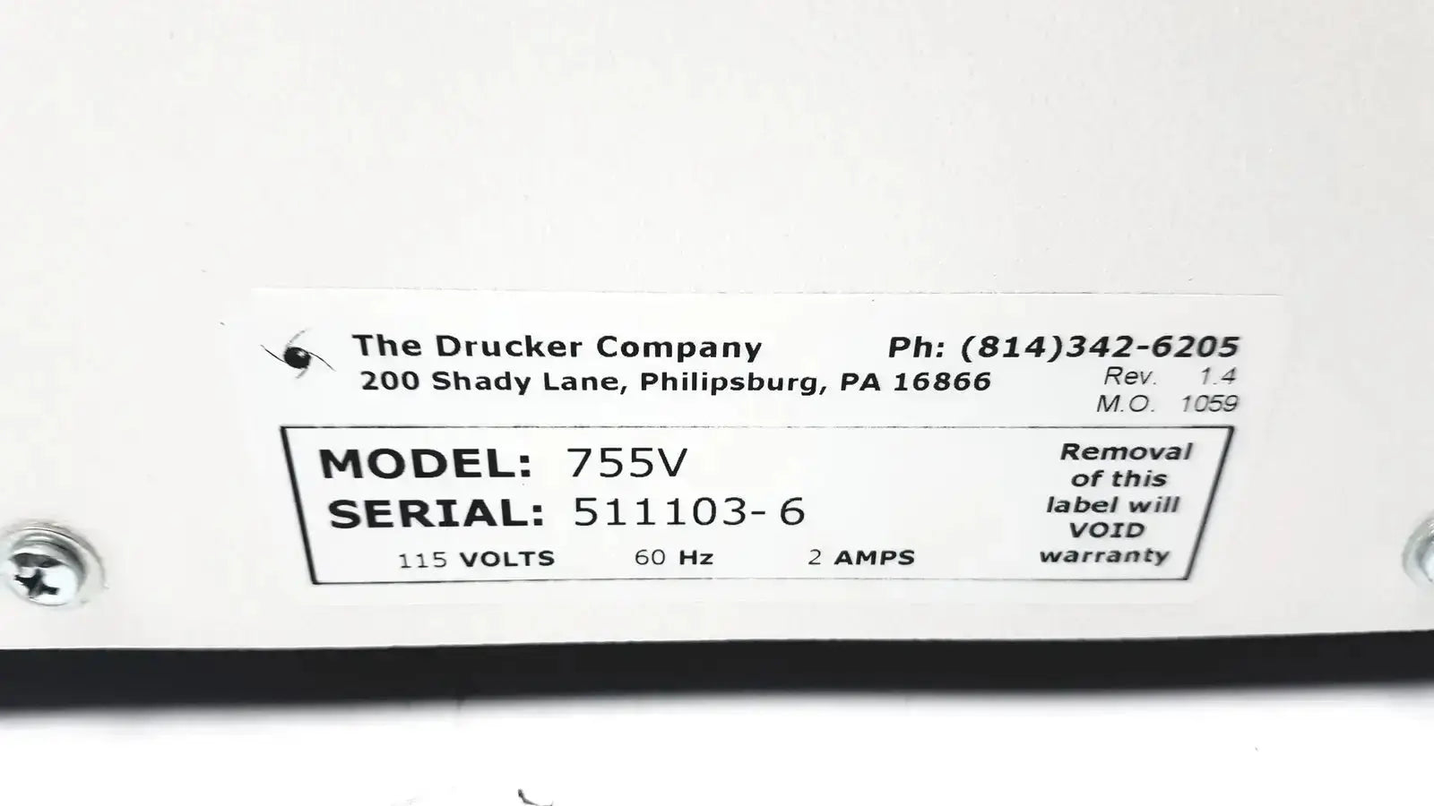 White rectangular label with manufacturer details and specs on the back of a drucker horizon laboratory centrifuge 755v for pre owned medical equipment sale