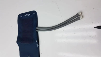 Navy blue duracuf crtikon bp cuff with gray tubing and white connectors cuff ref 2203 for blood pressure 23-33 cm