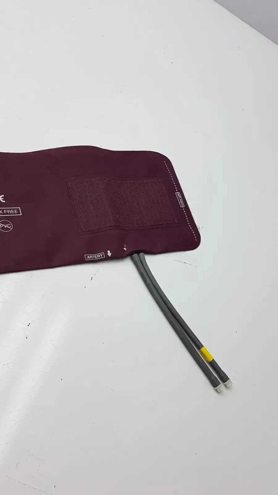 Dura Cuff Critikon blood pressure cuff 2204 maroon inflatable pressure cuff with gray tubing and yellow connector