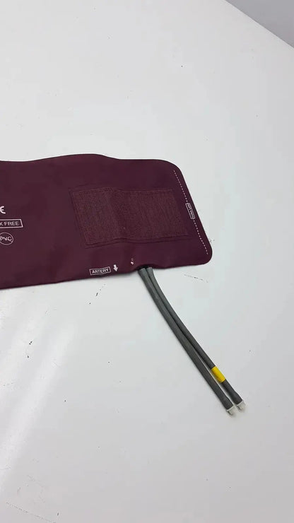 Dura Cuff Critikon blood pressure cuff 2204 maroon inflatable pressure cuff with gray tubing and yellow connector