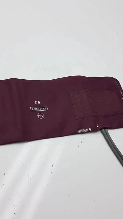 Maroon latex-free pvc Dura Cuff Critikon blood pressure cuff 2204 with velcro patch and attached tubing for blood pressure