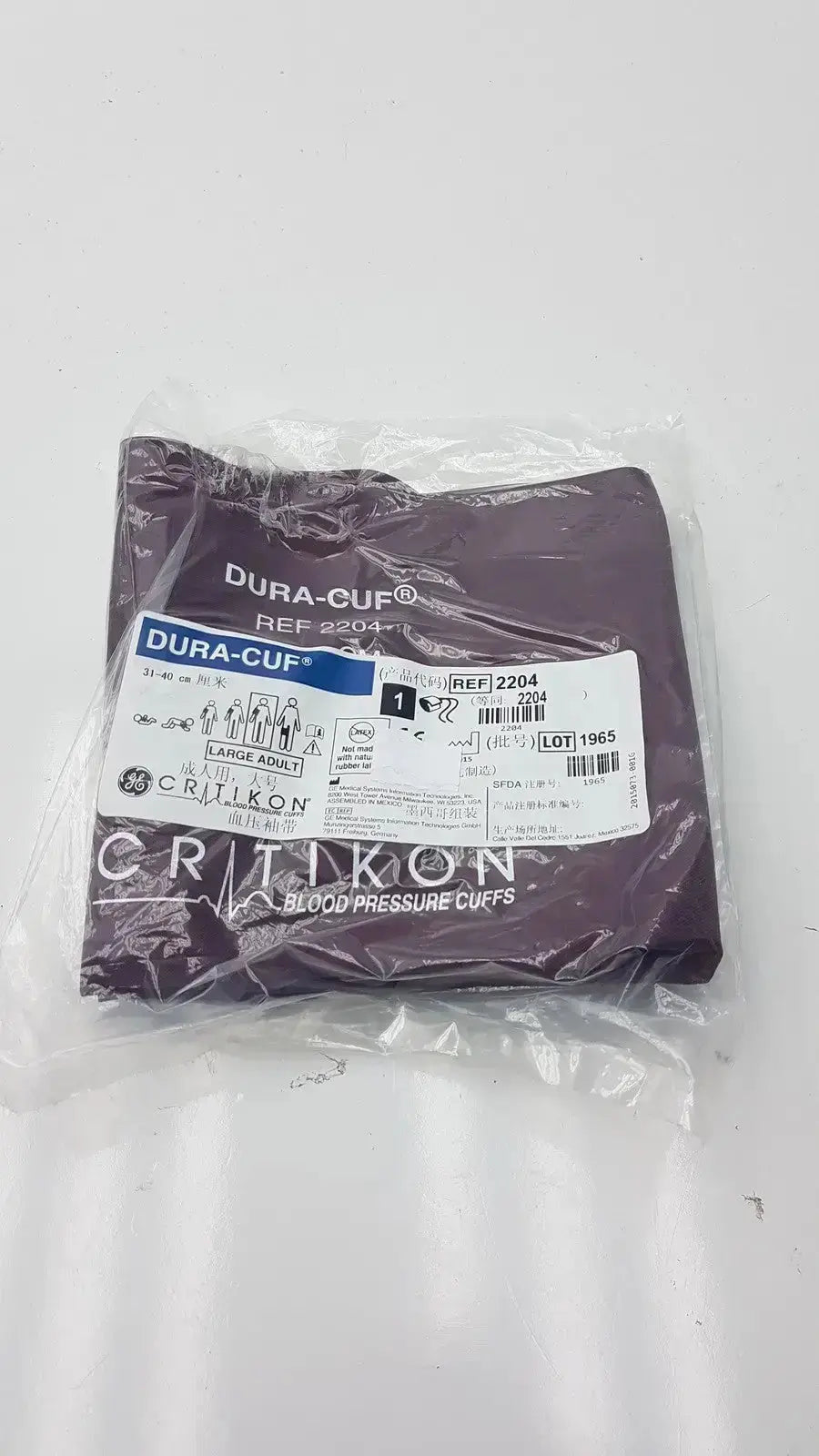 Purple dura-cuf blood pressure cuff by critikon in clear plastic packaging designed for accurate blood pressure monitoring
