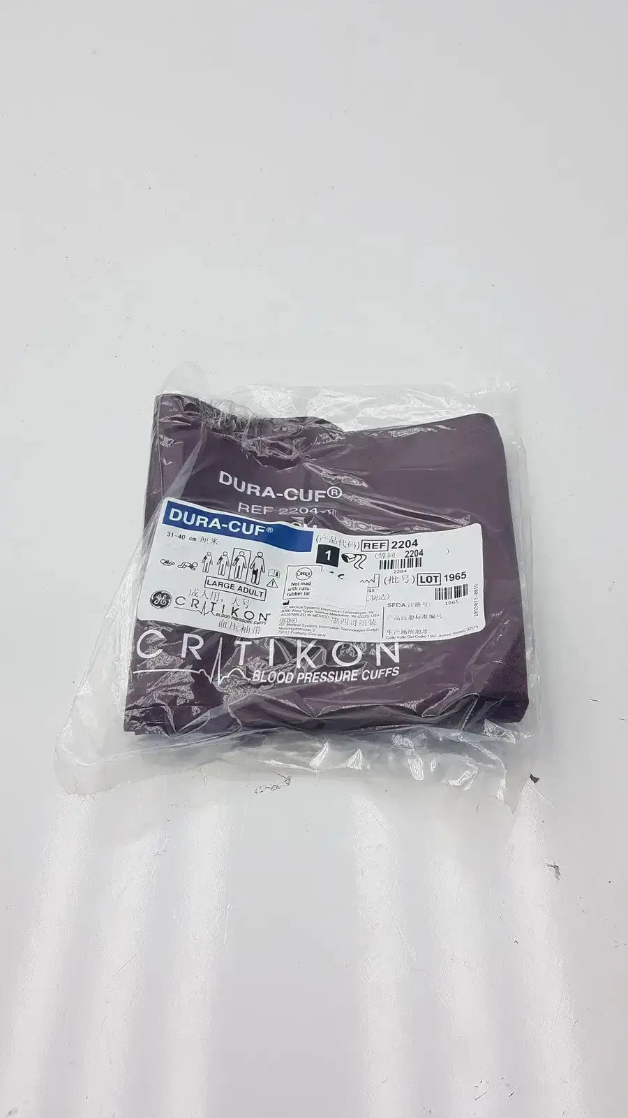 Purple dura cuff critikon blood pressure cuff model 2204 in clear plastic packaging for accurate blood pressure measurement