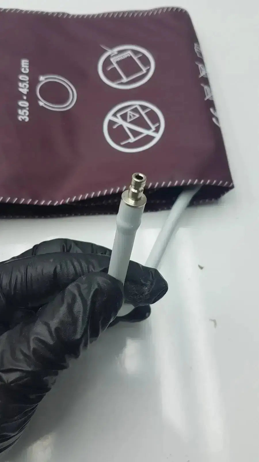 Gray rubber dura cuff critikon blood pressure cuff connector with metallic tip for accurate blood pressure measurement