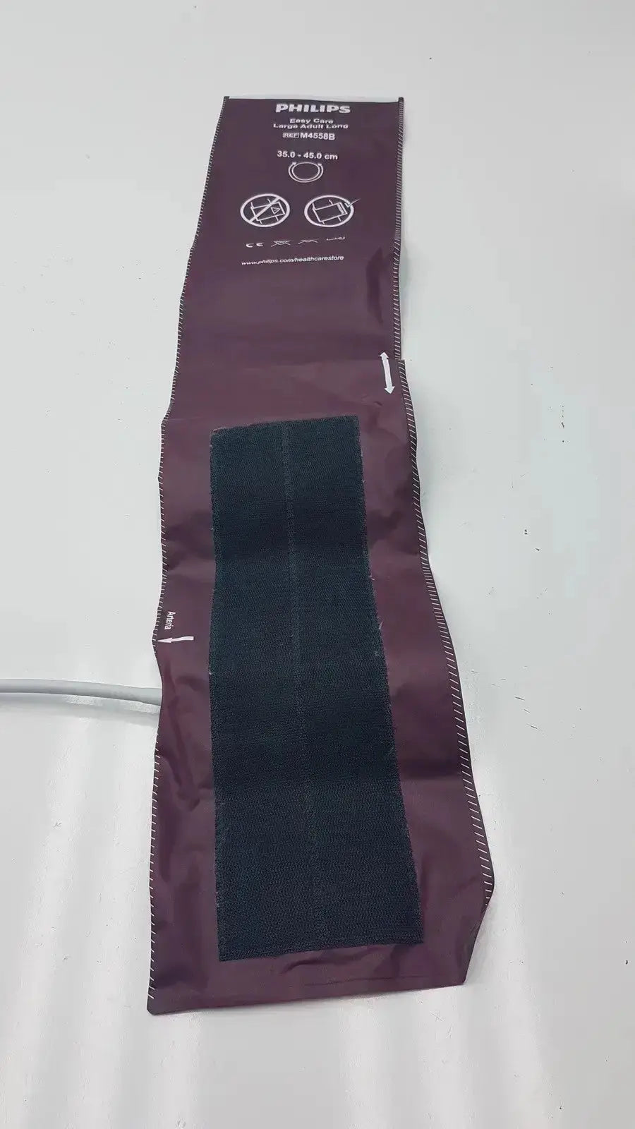 Dura cuff critikon blood pressure cuff model 2204 in maroon with black velcro strips for accurate blood pressure monitoring