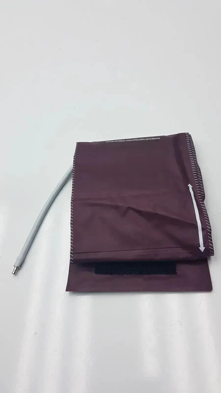 Maroon Dura Cuff Critikon blood pressure cuff model 2204 with gray tube for accurate blood pressure measurement