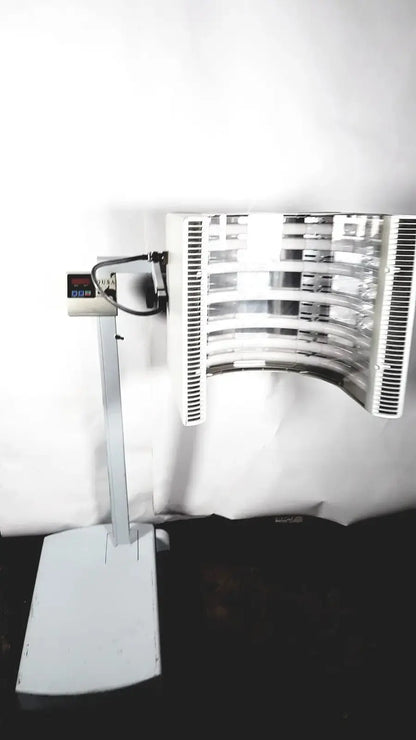 Silver industrial-grade digital scale with curved multi-tiered heating unit for dusa blu blue light photodynamic therapy system