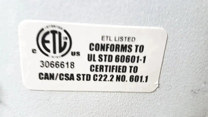 White rectangular label with black text and etl certification on the back of dusa blu blue light photodynamic therapy system 4170-2