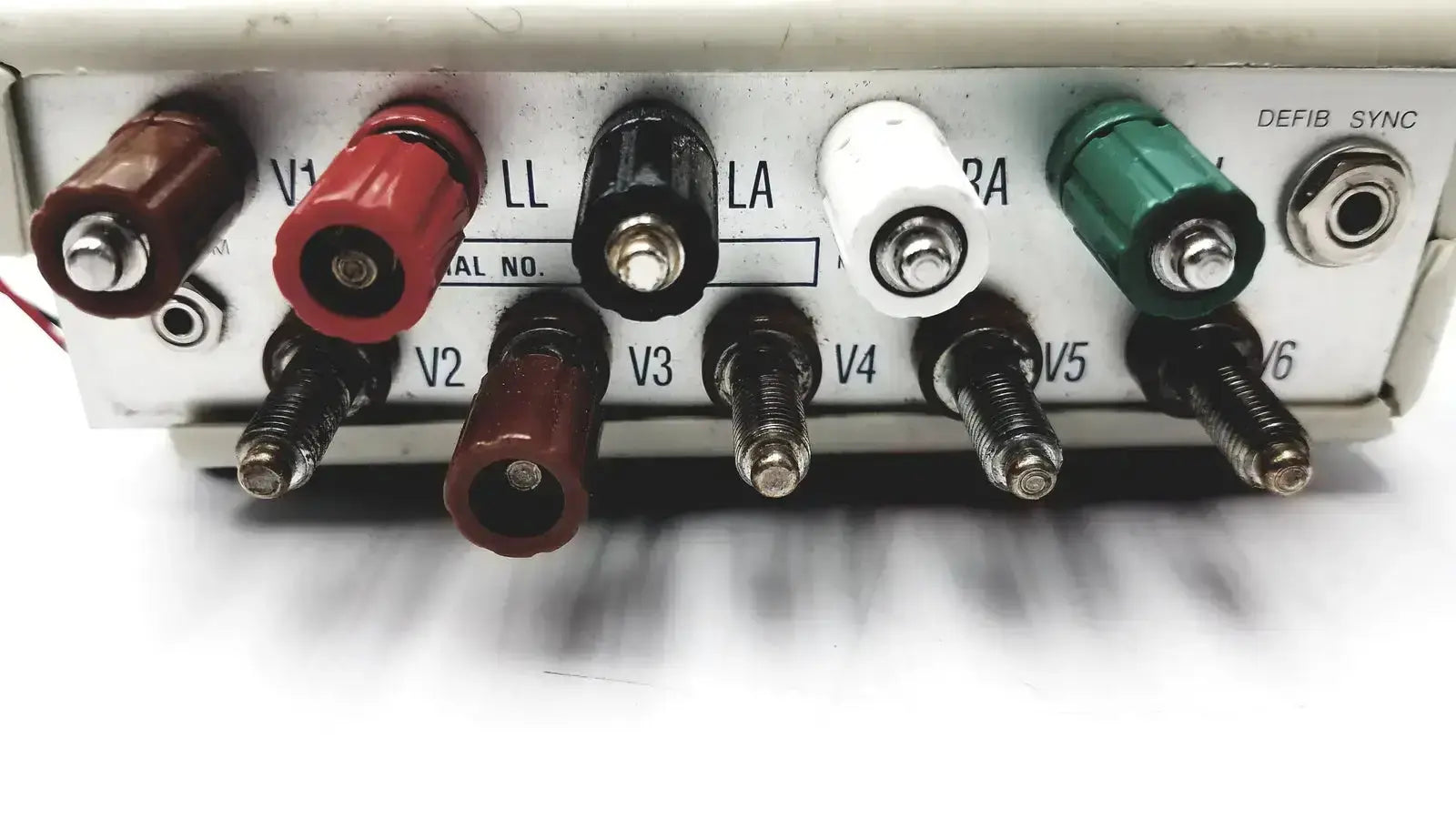 Multimeter with colorful red black white and green banana plug connectors in dynatech nevada 215a portable lightweight respiratory patient simulator