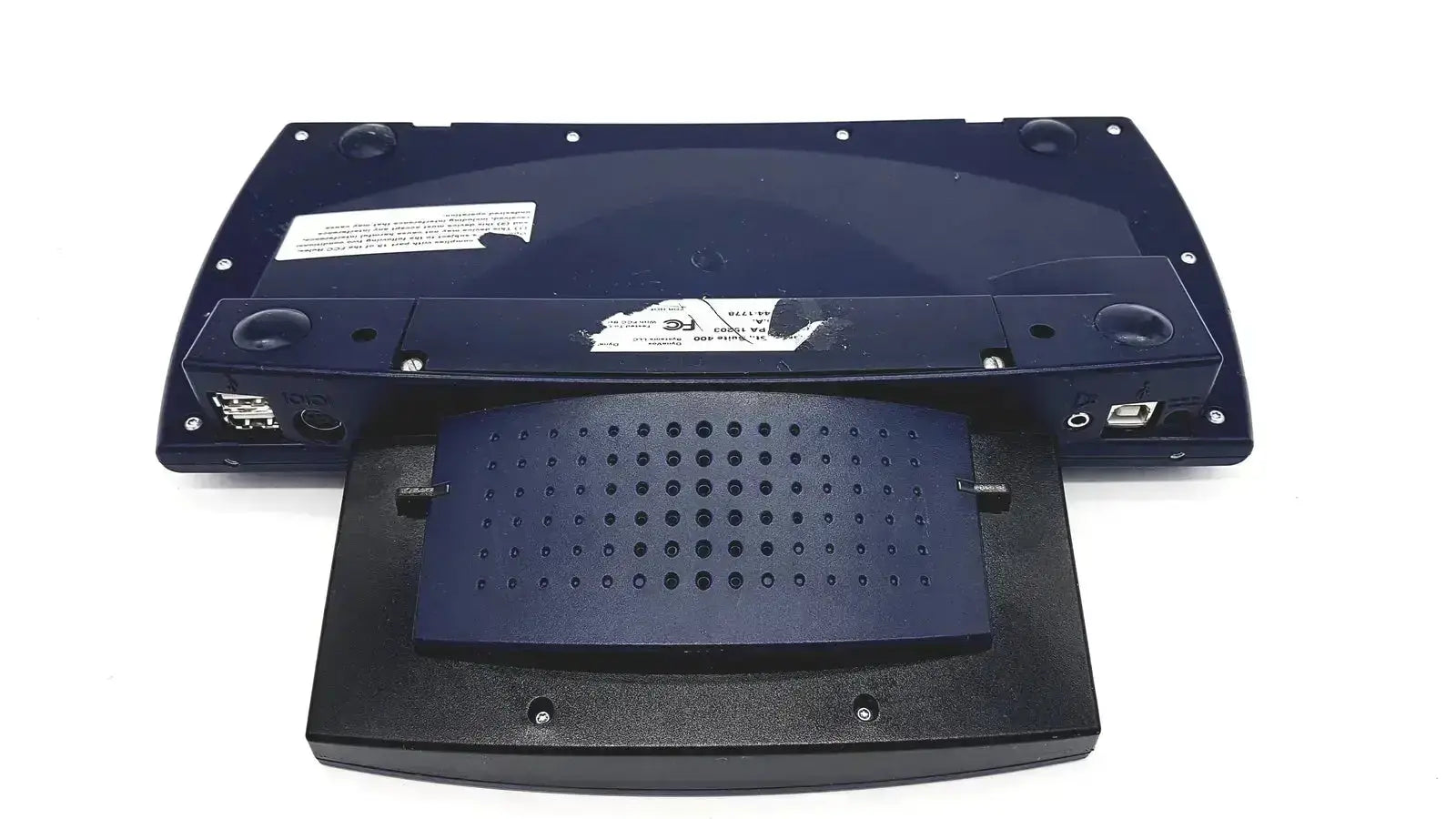 Black plastic laptop stand with dark blue perforated tray and usb ports for dynavox dynawrite speech processor
