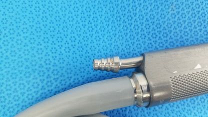 Silver metallic dyonics powermax elite shaver handpiece with textured grip and threaded connector for medical equipment use