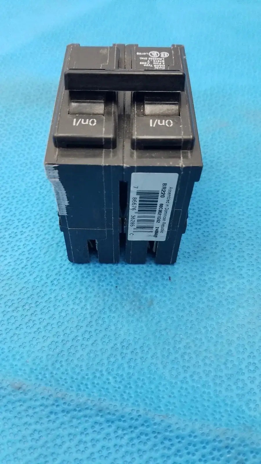 Black dual-pole molded plastic Eaton BR220 20 amp circuit breaker labeled 1/0 for reuse medical equipment safety