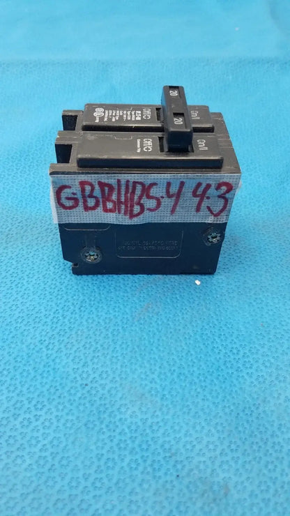 Black Eaton BR220 2-pole 20 amp circuit breaker with red handwritten label suitable for reuse medical equipment applications