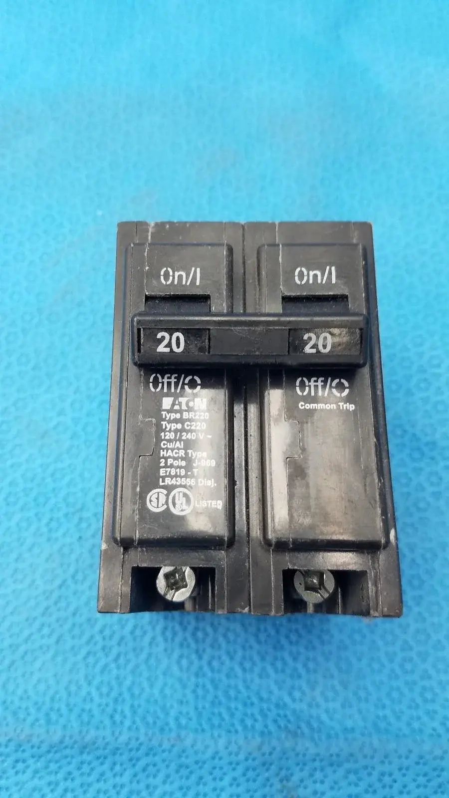 Black plastic dual 20 amp br220 circuit breaker with on off toggle and type c229 common trip for reuse medical equipment