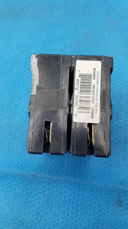Black plastic Eaton BR220 2-pole type BR 20 amp circuit breaker with white label for reuse medical equipment safety
