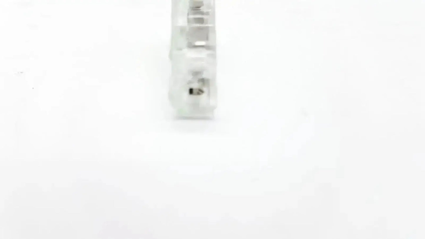 Clear plastic ecg adapter clip 2056813-014 rev a with visible internal metal contacts for secure electrical connection